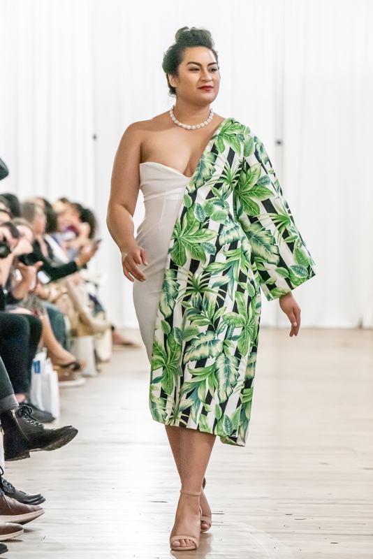 Model in a green palm-print look at the 2022 show