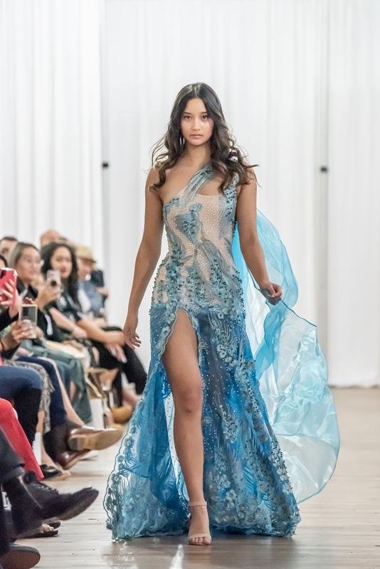 Model in a sheer blue gown at the 2022 show