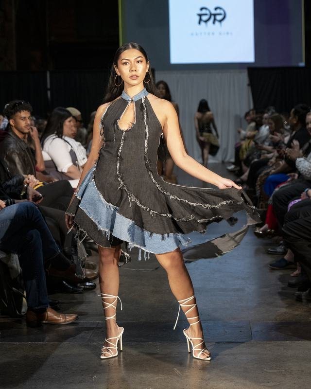 Model in a deconstructed denim dress at the 2024 show
