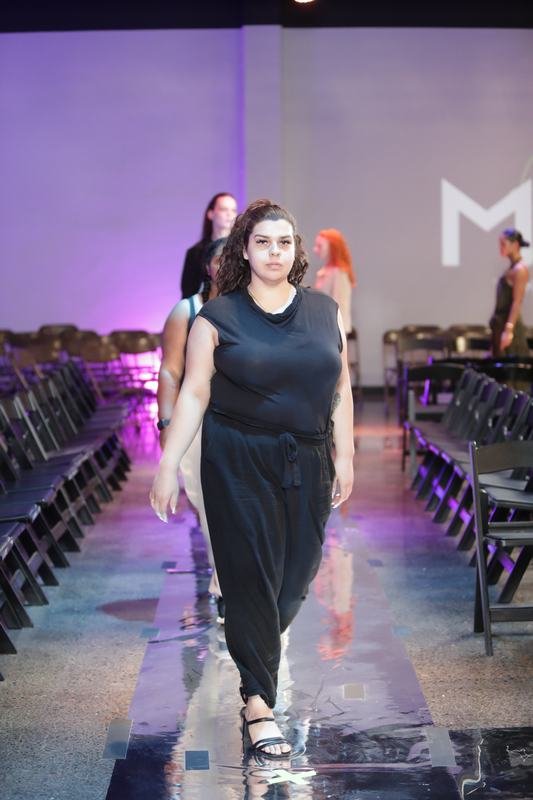 The audience takes in a runway look at Le Pasefika Runway 2025