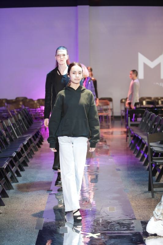 Model showcasing a designer garment at Le Pasefika Runway 2025