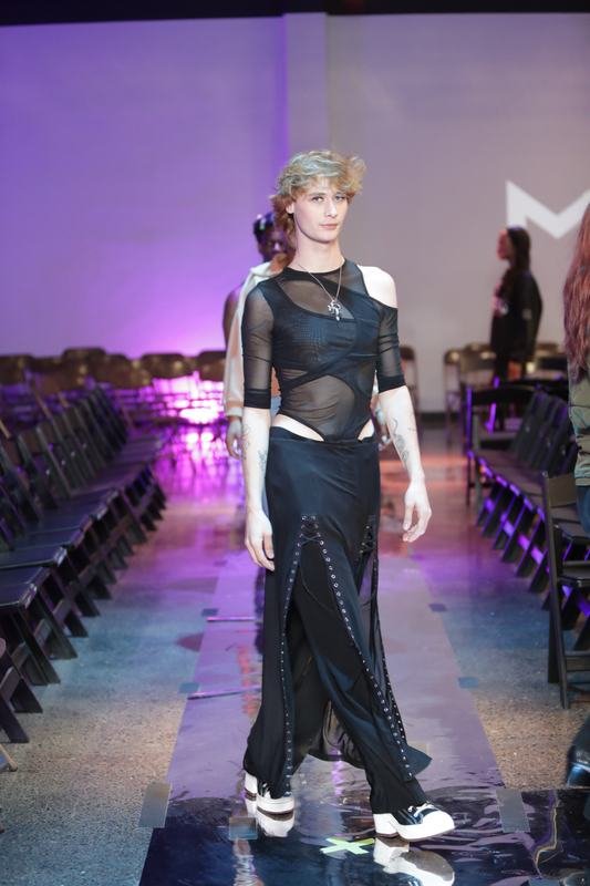 Model walking for a designer at Le Pasefika Runway 2025