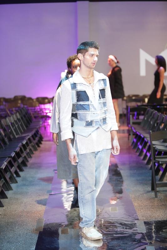 Model showcasing a designer garment at Le Pasefika Runway 2025