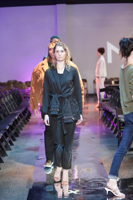 Model walking for a designer at Le Pasefika Runway 2025