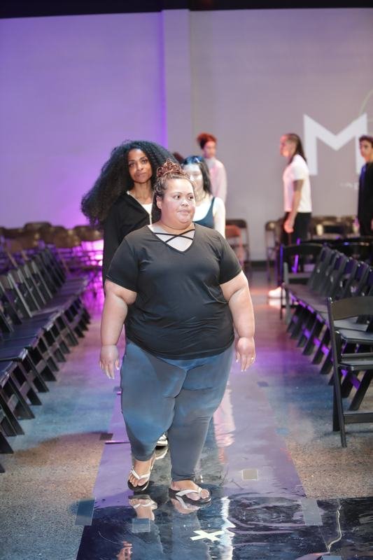 Model striking a pose on the runway at Le Pasefika Runway 2025