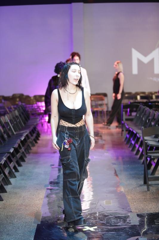 The audience takes in a runway look at Le Pasefika Runway 2025