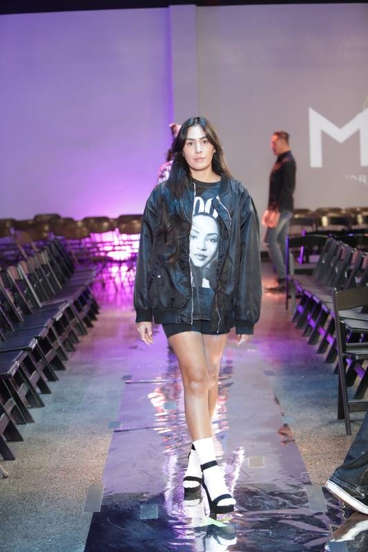 Model walking for a designer at Le Pasefika Runway 2025